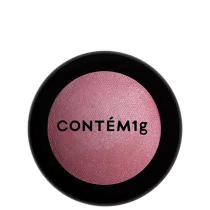 A imagem mostra uma embalagem fechada de blush. A embalagem é preta com parte transparente e o logo da marca em preto.
