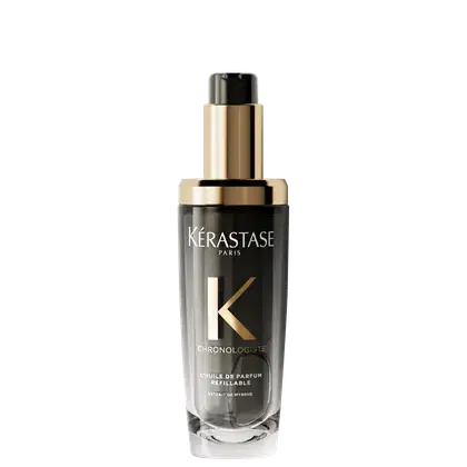 Frasco de óleo de perfume refinável da linha Chronologiste da Kérastase, com design elegante em tons de dourado e preto, destacando o logotipo da marca.
