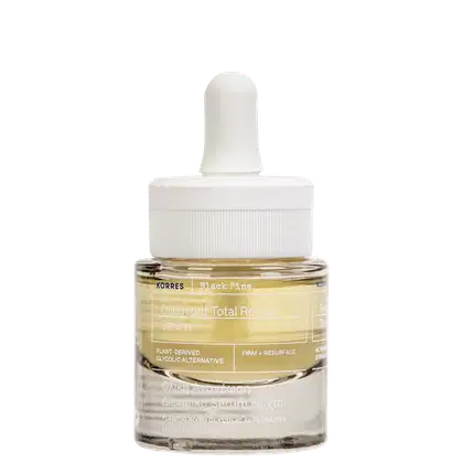 Frasco de vidro com sérum Korres Black Pine Overnight Total Revival, com conta-gotas branco, rótulo com informações sobre o produto e ingredientes.