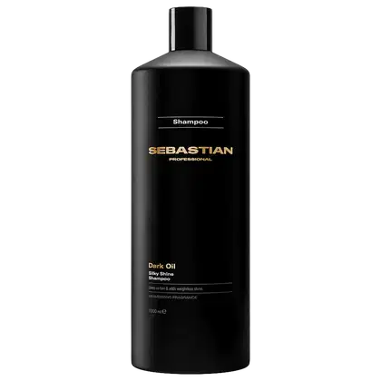Frasco preto de shampoo da marca Sebastian Professional, com rótulo em dourado e texto "Dark Oil Silky Shine Shampoo". O produto é apresentado em embalagem cilíndrica com tampa preta, em fundo escuro.