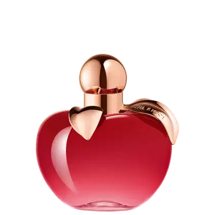 Frasco de perfume em formato de maça, com tampa dourada, em cor vermelha brilhante. Rótulo com nome da marca "Nina Ricci" visível.