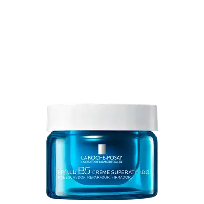 Frasco de creme facial da linha Hyalu B5 da La Roche-Posay, com embalagem de vidro azul brilhante e tampa branca. O rótulo destaca os benefícios de preenchimento, reparação e firmeza da pele.