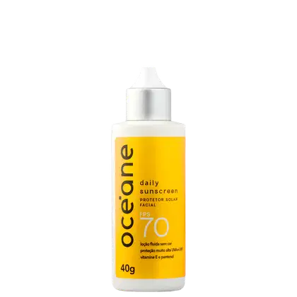 Frasco de protetor solar facial diário da marca Océane, com FPS 70, embalagem branca e amarela, contendo 40g do produto.
