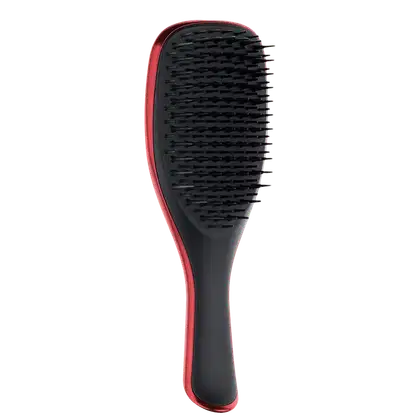 Escova de cabelo Tangle Teezer preta e vermelha, com design ergonômico e cerdas densas para desembaraçar e pentear os fios suavemente.