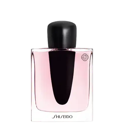 Perfume Ginza Shiseido Eau de Parfum com frasco de vidro, conteúdo rosa claro. Rótulo preto com nome da marca "SHISEIDO" em letras brancas. Embalagem simples e elegante com tampa preta.