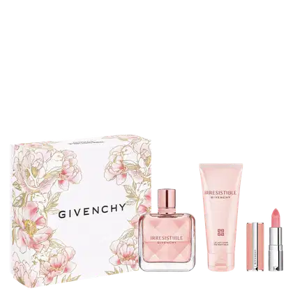 Conjunto de produtos de beleza da marca Givenchy, incluindo um frasco de perfume Irresistible, um tubo de creme corporal e um batom rosa, todos embalados em uma caixa decorada com flores em tons de rosa e prateado.