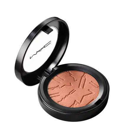 Compacto de maquiagem em tom bronze, com acabamento brilhante, em embalagem preta redonda com logotipo da marca. Produto de beleza com textura aveludada e design elegante.