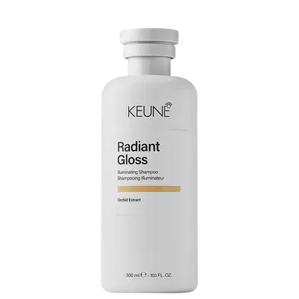 Frasco branco de 300 ml da linha Radiant Gloss da Keune, um shampoo iluminador com extrato de orquídea, com rótulo preto e branco destacando o nome da marca e do produto.