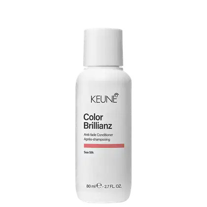 Frasco branco de 80 ml da linha Color Brillianz da Keune, um condicionador para cabelos coloridos, com rótulo preto e laranja destacando o nome do produto e a tecnologia "Sea Silk".