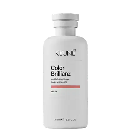 Frasco branco de condicionador da linha Color Brillianz da Keune, com rótulo preto e laranja indicando o nome do produto.
