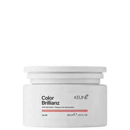Frasco branco da linha Color Brillianz da Keune, contendo máscara anti-descoloração com 250 ml.