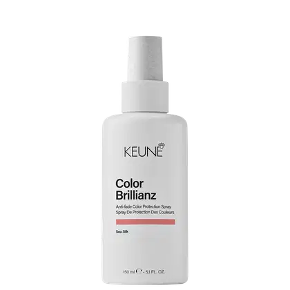 Frasco branco de 150 ml da linha Color Brillianz da Keune, um spray de proteção de cor contra desbotamento. Rótulo com o nome da marca e do produto em preto.