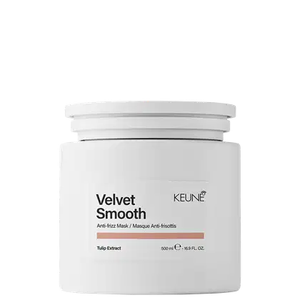 Frasco branco com rótulo "Velvet Smooth" da marca Keune. O rótulo apresenta informações de texto em preto sobre o extrato de tulipa como ingrediente.