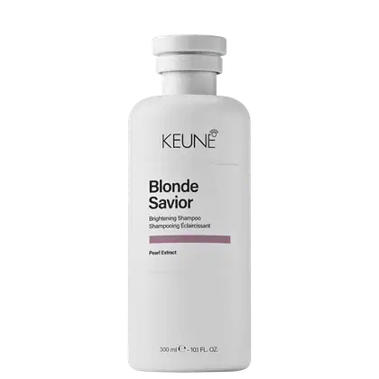Frasco branco com rótulo da marca Keune, contendo o produto "Blonde Savior", um shampoo clareador com extrato de pérola. Texto em preto.