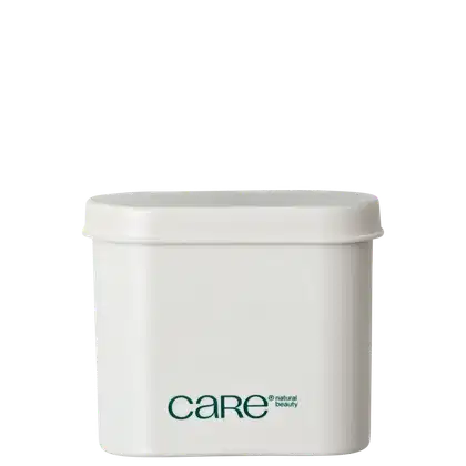 Recipiente branco cilíndrico com tampa, contendo produto de beleza da marca Care. O rótulo verde apresenta o nome da marca e a descrição "natural beauty".