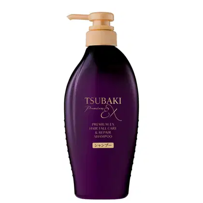 Frasco de shampoo Tsubaki Premium EX de 450 ml, com embalagem roxa e detalhes dourados, apresentando bomba dosadora.