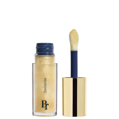 Gloss Labial de Bruna Tavares BT Banana Jelly Oil, com 6ml, em embalagem transparente, interior com detalhes em azul e tampa dourada. 