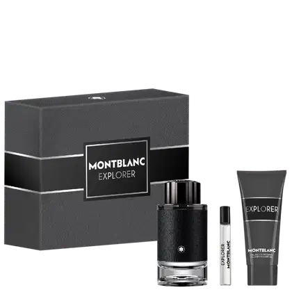 Caixa cinza com rótulo preto exibindo "MONTBLANC EXPLORER". Dentro, um frasco de perfumaria preto com tampa e um tubo de gel preto com rótulo "EXPLORER". Embalagem e produtos em tons escuros, com design minimalista e elegante.
