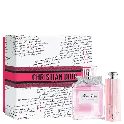Caixa rosa com logotipo da Christian Dior Paris e frasco de perfume Miss Dior Blooming Bouquet e lip balm Dior Addict