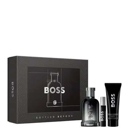 Conjunto de produtos de beleza da marca Boss, composto por dois frascos de perfume, um gel de banho e uma caixa preta com design minimalista e detalhes em prata.