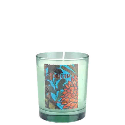 Vela aromática em frasco de vidro verde-claro com rótulo ilustrado em tons de azul, marrom e laranja, exibindo a marca "Phebo" e a fragrância "Jasmin".