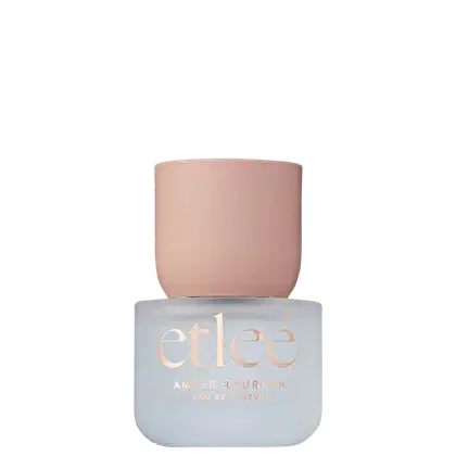 Frasco de perfume Etleé Amber Bourbon, transparente com letras douradas, exibindo o nome da marca em destaque.