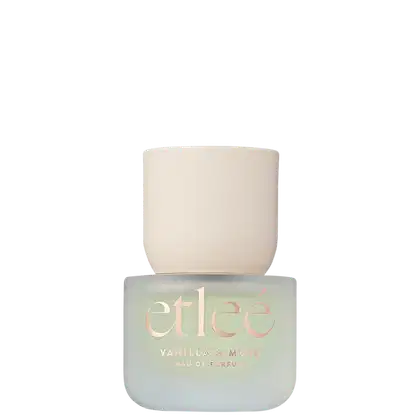 Frasco de perfume Etleé em tons de verde claro e branco. Rótulo com o nome da marca e a fragrância "Vanilla & Musk" em destaque e letras douradas