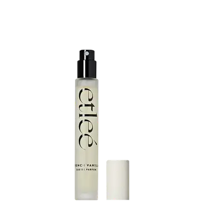 Frasco de perfume Etleé com design minimalista em preto e branco. Rótulo com o nome da fragrância "French Vanilla" em destaque. Embalagem compacta e elegante, com bico pulverizador.