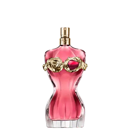 Frasco de perfume Jean Paul Gaultier com formato curvilíneo e tampa dourada. O frasco exibe uma silhueta feminina, destacada por um detalhe floral dourado e um toque granada, preenchido com um radiante líquido rosa-alaranjado.