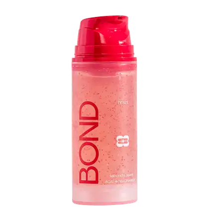 Frasco plástico rosa com tampa vermelha contendo sabonete líquido da marca Bond Rio com ingredientes de açaí e niacinamida, com texto "reset" visível no rótulo.