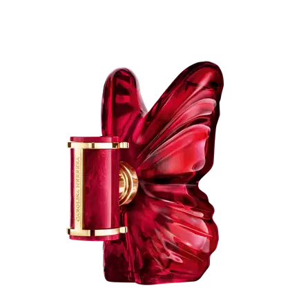 Frasco de perfume Carolina Herrera em formato de borboleta, com tampa dourada e corpo em tom vermelho intenso, destacando-se pela sua forma escultural e elegante.