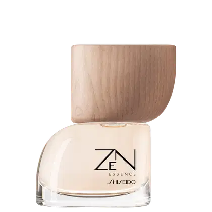 Frasco de vidro com tampa de madeira de formato arredondado, contendo item de perfumaria da marca Shiseido com rótulo preto e branco exibindo o nome "ZEN ESSENCE".