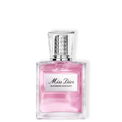 Frasco de item de perfumaria Miss Dior Blooming Bouquet com líquido rosa, embalagem em vidro transparente com tampa prateada texturizada e rótulo branco no centro.
