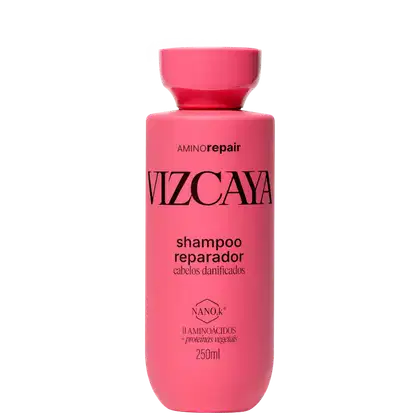 Frasco rosa com rótulo "Vizcaya Amino Repair Shampoo Reparador" para cabelos danificados, contendo 250ml do produto, com informações sobre aminoácidos e proteínas vegetais na composição.
