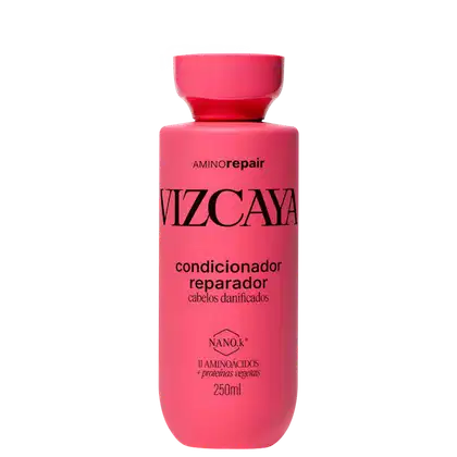 Frasco rosa de condicionador reparador Vizcaya Amino Repair, com 250ml de capacidade, contendo informações sobre os ingredientes e benefícios do produto em seu rótulo.