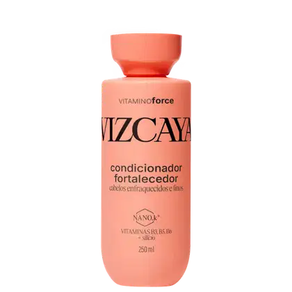 Frasco de condicionador fortalecedor Vizcaya, com embalagem rosa e texto em preto destacando os benefícios do produto para cabelos enfraquecidos e finos. O recipiente possui 250 ml e contém vitaminas B3, B5 e B6 além de silício em sua composição.