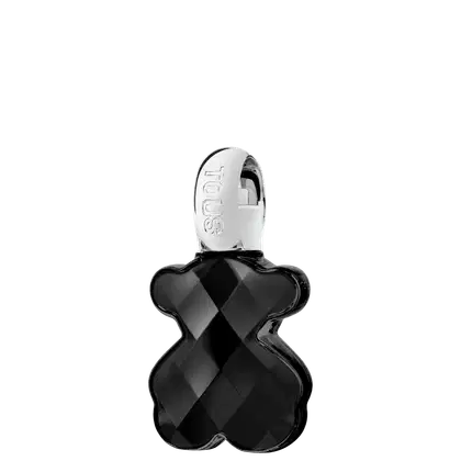 Frasco de item de perfumaria preto com formato geométrico e textura facetada, com logotipo "TOUS" em relevo na tampa branca.