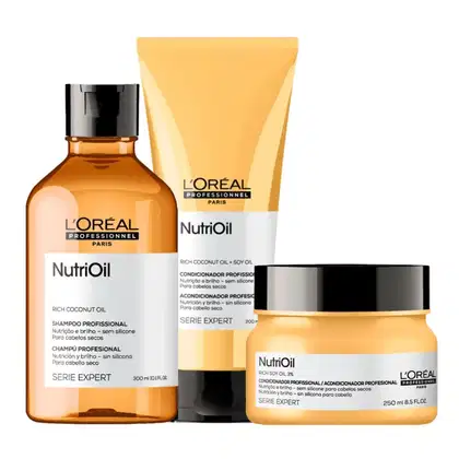 A imagem mostra um kit da linha NutriOil de L'Oréal, sendo um shampoo, um frasco tubular de condicionador e um pote redondo de máscara capilar. Todos possuem a cor amarela.