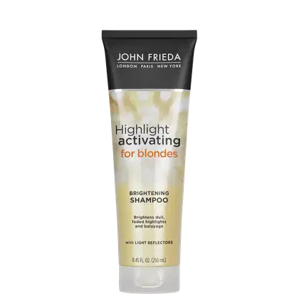 Embalagem tubular preta com detalhes dourados e texto branco. Rótulo indicando "Highlight activating for blondes Brightening Shampoo" (Shampoo ativador de luzes para loiras e iluminador). Menciona que ilumina luzes opacas, realça e revitaliza a cor.