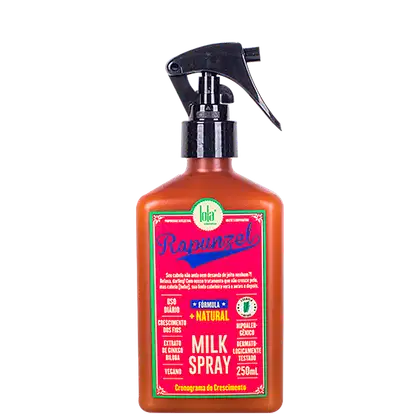Frasco de spray de leite da marca Lola From Rio, com rótulo rosa e verde destacando a fórmula natural e vegana do produto. O frasco possui um gatilho preto e contém 250 ml do produto.