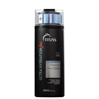 Frasco preto de shampoo da marca Truss, com rótulo em branco e vermelho. O produto é descrito como indicado para cabelos extremamente ressecados e danificados, contendo ativos orgânicos de alta tecnologia.