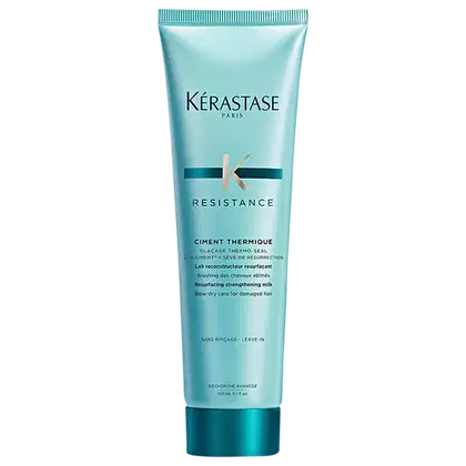 Tubo de tratamento capilar Kérastase Resistance Ciment Thermique, com embalagem de cor azul-esverdeada, contendo informações sobre o produto em inglês e francês.