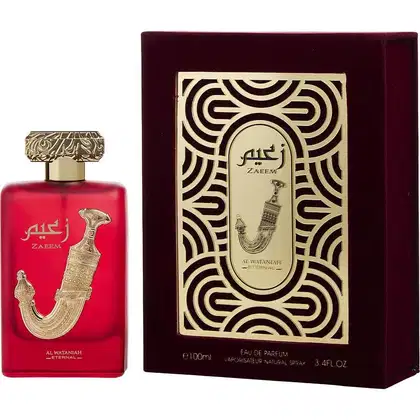 Frasco de perfume vermelho com detalhes dourados em caixa decorativa com padrões geométricos pretos e dourados. O rótulo exibe o nome "Zaeem" e a inscrição "Al Wataniah".