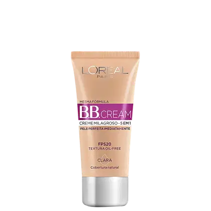 Tubo de BB Cream da L'Oréal Paris, com fórmula milagrosa 5 em 1, textura oil-free e cobertura natural. Embalagem em tons de bege e roxo, com informações sobre o FPS 20 e a cor clara.