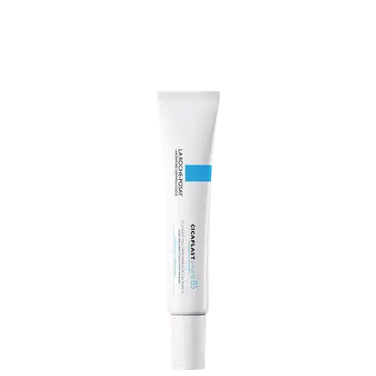 Tubo branco de produto de beleza da marca La Roche-Posay, com rótulo azul indicando "Cicaplast Baume B5". Embalagem cilíndrica com tampa rosqueável, projetada para aplicação tópica.