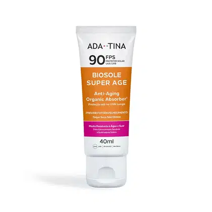 Frasco de protetor solar da marca Ada-Tina, com FPS 90, na cor laranja e branca. O rótulo indica que se trata do produto "Biosole Super Age", um absorvente orgânico anti-envelhecimento com proteção UVA/UVB.