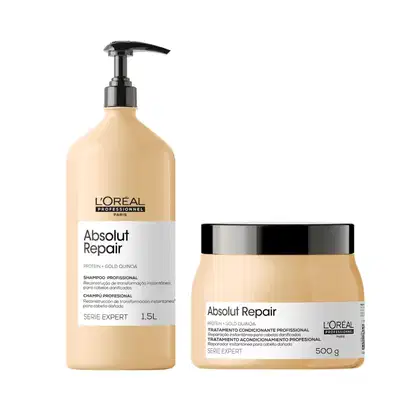 A imagem mostra dois produtos da linha Absolut Repair da L'Oréal Professionnel. Um é um shampoo profissional em uma embalagem plástica bege. O outro é um tratamento condicionante profissional em um pote bege com tampa preta.