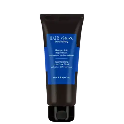 Tubo preto com rótulo azul e branco. Texto "Hair rituel by Sisley" e "Regenerating Hair Care Mask" em destaque. Embalagem de produto de cuidados capilares com quatro óleos vegetais, para tratamento regenerador.