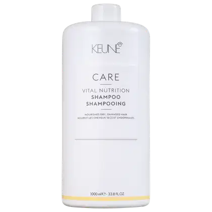 Frasco branco da linha Keune Care Vital Nutrition, contendo shampoo para cabelos secos e danificados. Rótulo com nome do produto e informações sobre o uso.