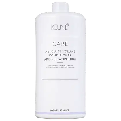 Frasco branco de condicionador Keune Care Absolute Volume, com rótulo em cinza e branco indicando o nome do produto e sua função de dar volume aos cabelos finos.
